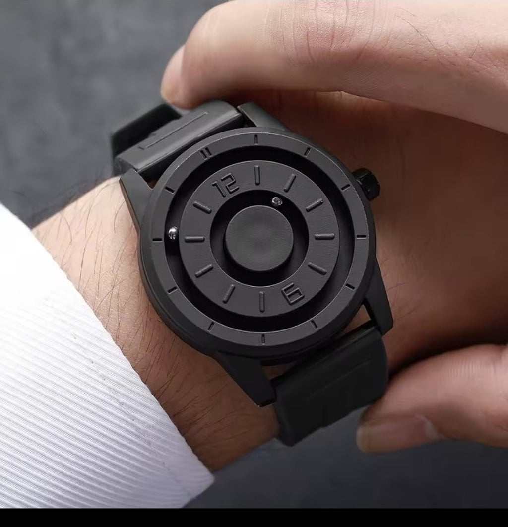 Black magnetic suspension men's watch worn on wrist
