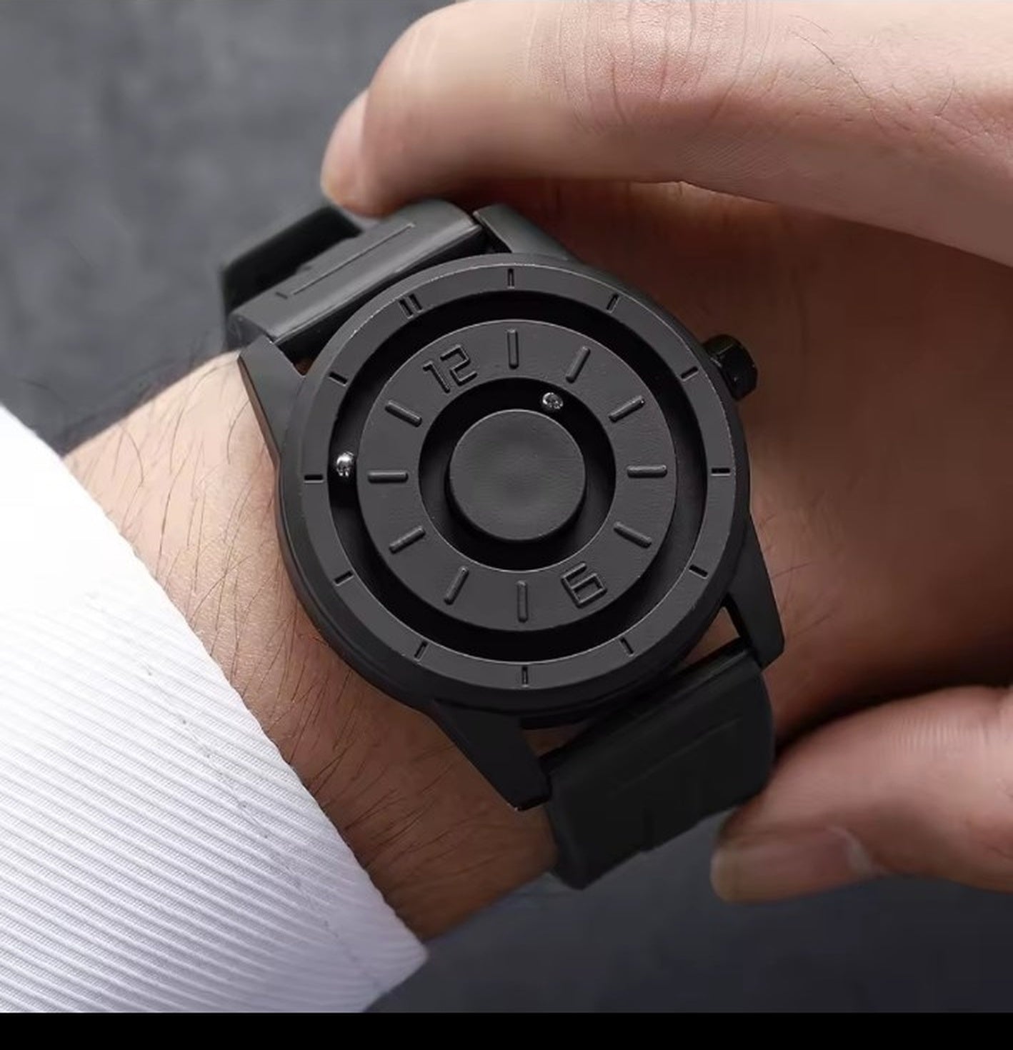 Black magnetic suspension men's watch worn on wrist